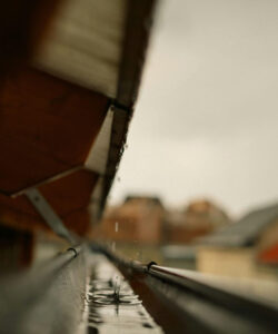 Heavy spring rains filling a gutter.